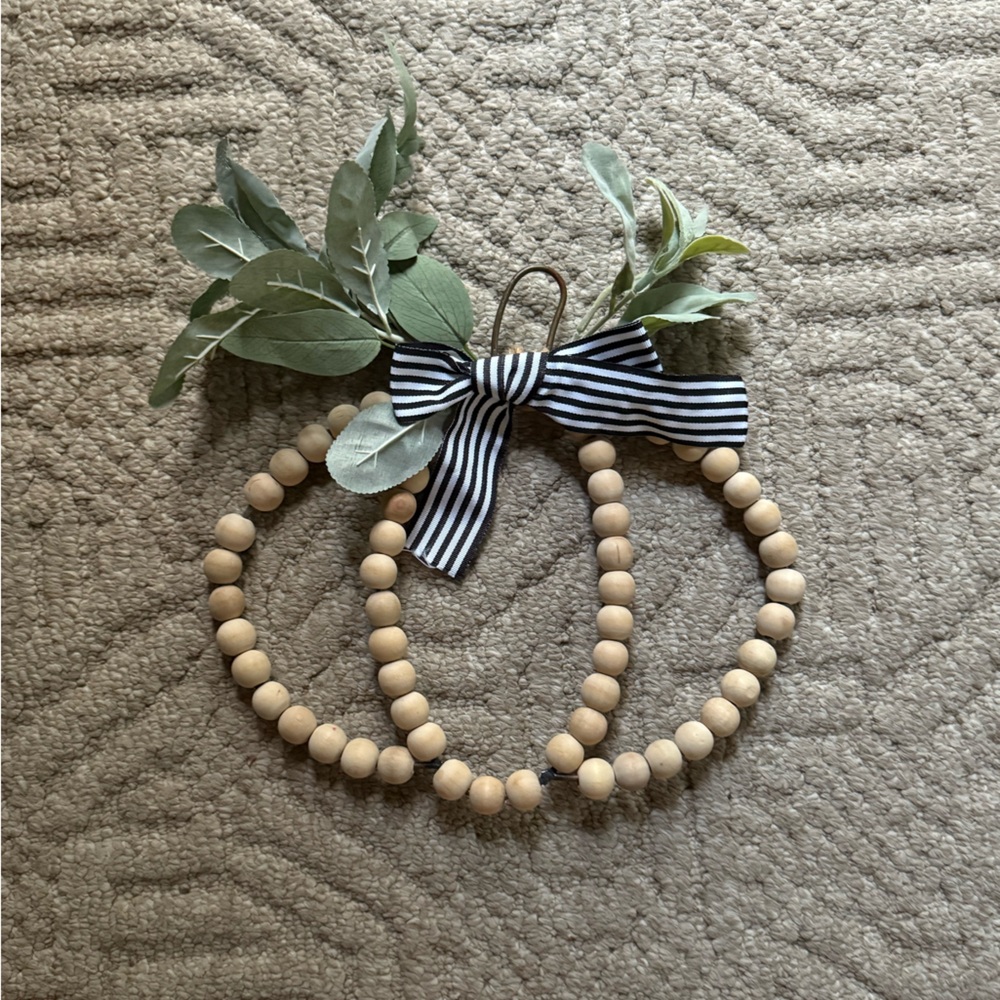 Wooden Bead Pumpkin Decor with Greenery and Striped Bow